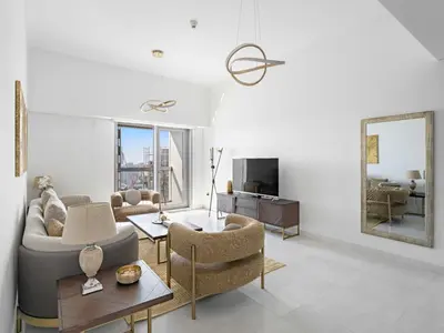 a living room with a couch and a table at Luxurious High Floor 1BDR With Full Sea View-Cayan48 in Dubai