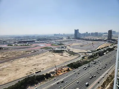 an aerial view of a highway with traffic at 16 Studio in Skyz By Danube, Arjan in Dubai