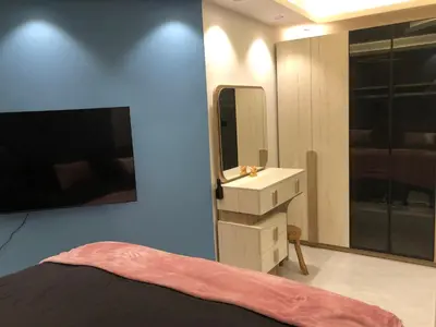 a bedroom with a sink and a mirror at Beautiful newly renovated apartment in the heart of Dubai in Dubai