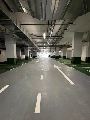 an empty parking lot in a parking garage at Stylish Brand New 2 bed Stay near Marina in Dubai