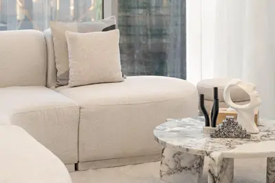 a living room with a couch and a table at FIRST CLASS 2BR Marina, Sea & Ain Views in Dubai