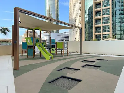 a playground with a slide on a roof at FIRST CLASS 2BR Marina, Sea & Ain Views in Dubai