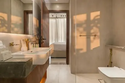 a bathroom with a sink and a toilet at Modern Studio Apartment in Binghatti Tulip with Pool, Parking, Gym in Dubai