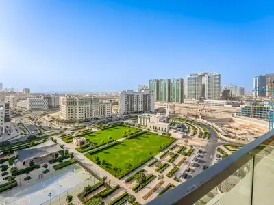 a view of a city with tall buildings at Dubai Miracle Garden Modern Luxury Studio Pool, Padel Court & Sauna Arjan in Dubai