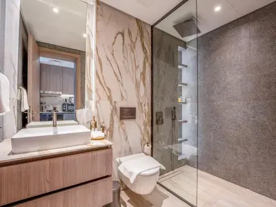 a bathroom with a sink toilet and a shower at Dubai Miracle Garden Modern Luxury Studio Pool, Padel Court & Sauna Arjan in Dubai
