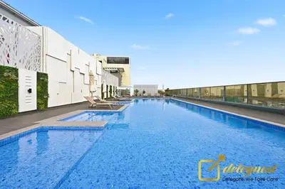 a large swimming pool on top of a building at Luxury Studio in Dubai Hills by Deleguest in Dubai