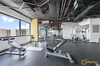a gym with several treadmills and cardio machines at Luxury Studio in Dubai Hills by Deleguest in Dubai