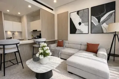 a living room with a couch and a table at Luxury 1BR W Private Pool Binghatti Royale in Dubai