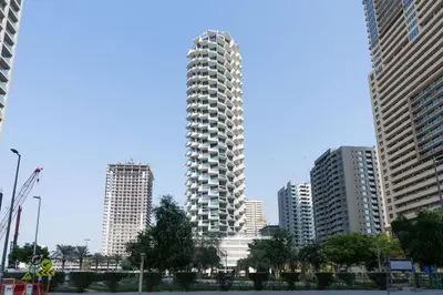 a tall building in a city with tall buildings at Luxury 1BR W Private Pool Binghatti Royale in Dubai