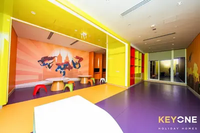 a room with colorful walls and a table and chairs at Elegant Studio Living in Privé in Dubai