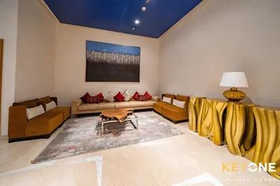 a living room with a couch and a table at Elegant Studio Living in Privé in Dubai