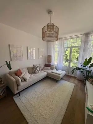 a living room with a couch and a rug at Skyline Breeze Living in Dubai