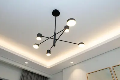 a chandelier hanging from the ceiling in a room at Escape24 Luxury Studio 100