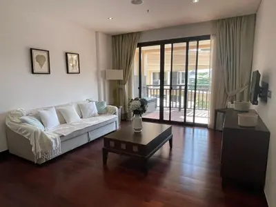 a living room with a white couch and a table at One bedroom appartment Palm Jumeirah in Dubai