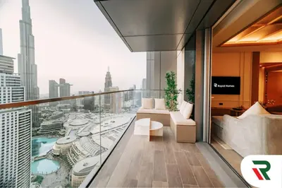 a hotel room with a view of a city at 4 Bedroom Burj View Apartment In Downtown Dubai in Dubai