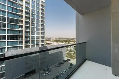 a balcony with a view of a tall building at Urban Haven Pool, Gym & Spectacular Views in Dubai
