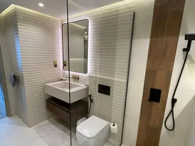 a bathroom with a toilet and a sink at Luxury 2 Bedroom Shemara Tower Dubai Marina in Dubai