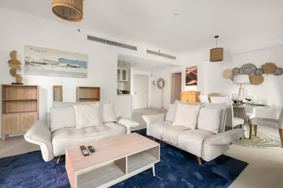 a living room with two couches and a coffee table at FIRST CLASS 1BR Luxury Marina View Escape in Dubai