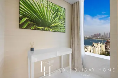 a room with a window with a view of the city at LUX Iconic Views at The Palm Tower Suite 8 in Dubai