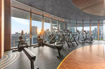 a gym with a view of a city at have fun with your family and friends in our apt in Dubai