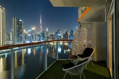 a balcony with a view of a city skyline at Gogoto6 2BR Super Premium Canal & Burj Khalifa View in Dubai