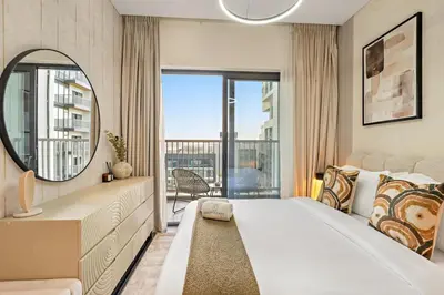 a bedroom with a large bed and a mirror at FIRST CLASS 2BR Classy Getaway Near Downtown in Dubai