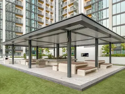 a pavilion with benches and tables in a city at FIRST CLASS 2BR Classy Getaway Near Downtown in Dubai