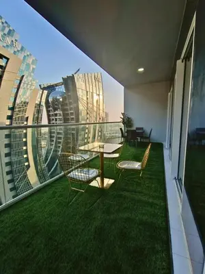 a balcony with a table and chairs on a building at Canal View - 10 Minutes Walk to Dubai Mall in Dubai