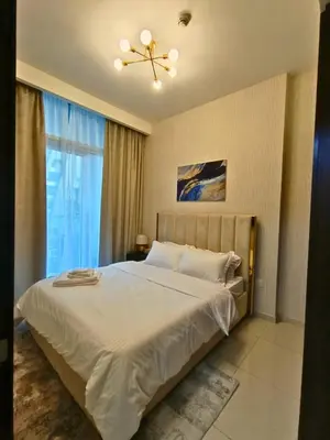 a bedroom with a bed and a ceiling fan at Canal View - 10 Minutes Walk to Dubai Mall in Dubai