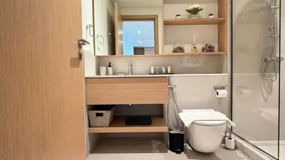a bathroom with a sink and a shower and a toilet at Serene 1BDR in Dubai Hills with Balcony in Dubai