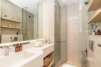 a bathroom with a shower and a toilet and a sink at Modern & Cozy JVC Studio Couple or Solo in Dubai