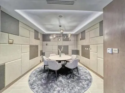 a dining room with a table and chairs at Luxurious Burj Vista Apartment with Burj Khalifa view in Downtown Dubai in Dubai