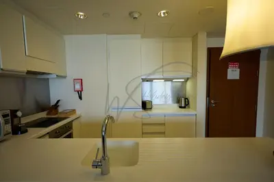 a kitchen with a sink and a faucet at EMAAR Residences Fashion Avenue 1BHK by WS Holiday Homes in Dubai