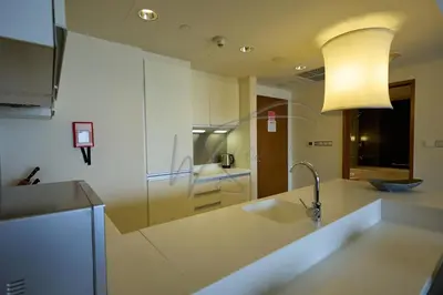 a kitchen with a sink and a lamp on a counter at EMAAR Residences Fashion Avenue 1BHK by WS Holiday Homes in Dubai