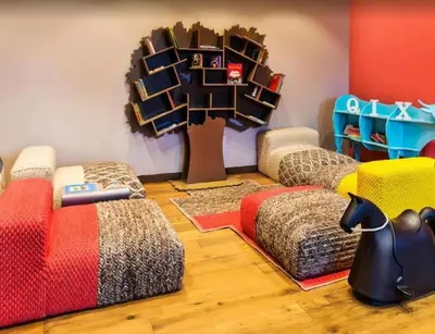 a childrens room with two beds and a tree at EMAAR Residences Fashion Avenue 1BHK by WS Holiday Homes in Dubai