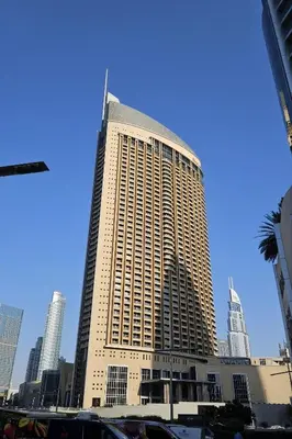 a large building in the middle of a city at EMAAR Residences Fashion Avenue 1BHK by WS Holiday Homes in Dubai