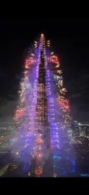 an image of a tall building lit up at night at High Rise Building in Burj Vista with Burj Khalifa View in Dubai