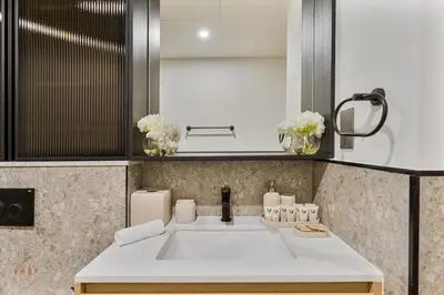 a bathroom with a sink and a mirror at Executive 1BR at Hadley Heights, JVC Dubai with balcony City Views in Dubai