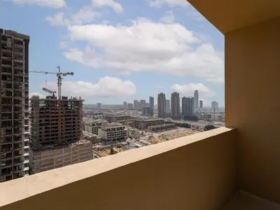 a view of a city from the balcony of a building at Exquisite Lavish Studio in Ghalia JVC -16 in Dubai