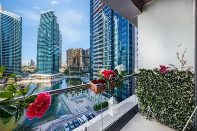a balcony with a view of a city with tall buildings at Daniels Studio with Lake View in JLT in Dubai