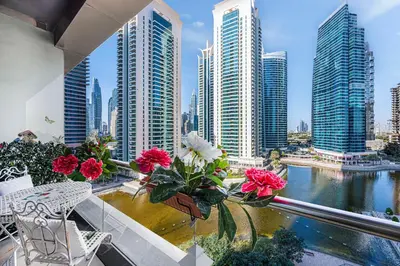 a balcony with a view of a city with tall buildings at Daniels Studio with Lake View in JLT in Dubai