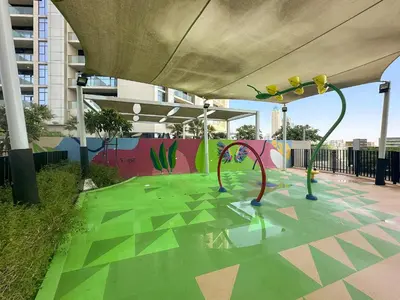 a painting of a playground in a building at Daniels 2BR with Canal View at Aykon City in Dubai