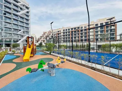 a playground with a slide at Frank Porter - Oxford Gardens in Dubai