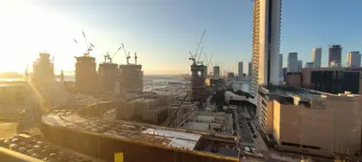 a view of a city with buildings and cars at Silk Valley - Luxury 1BR: Steps to Barasti Beach & Marina Walk in Dubai