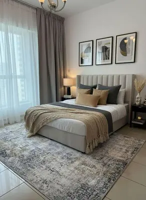 a bedroom with a large bed and a rug at Palm Sea View - Dubai Marina- 2 Bedrooms in Dubai