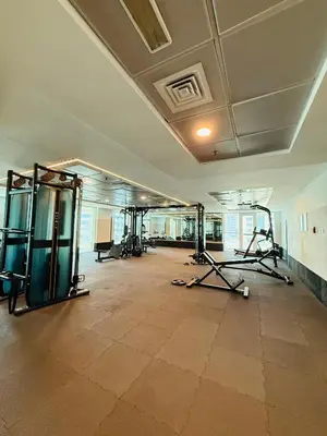 an empty gym with several treadmills and exercise bikes at Palm Sea View - Dubai Marina- 2 Bedrooms in Dubai
