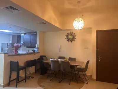 a dining room with a table and chairs at Vip private room ladies only in Dubai