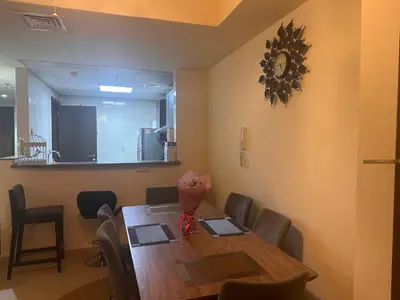 a dining room with a table and chairs and a mirror at Vip private room ladies only in Dubai