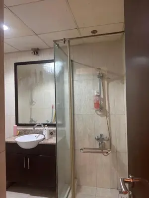a bathroom with a shower and a sink at Vip private room ladies only in Dubai