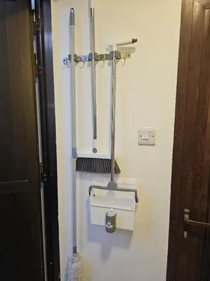a bathroom with two utensils on a wall at Elegant Grey Studio Room with Free Parking and Gaming in Dubai